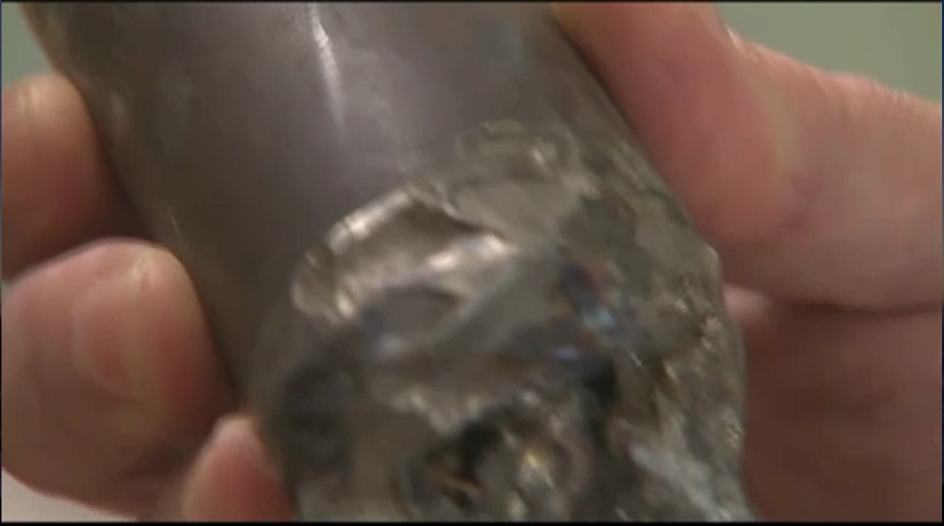 Captured video image of metallic debris with signs of some melt damage