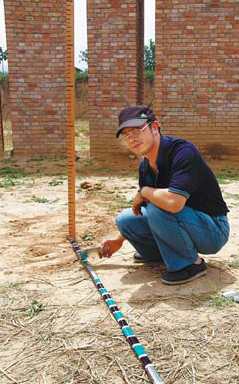 Photo of a reconstructed pillar made of brick at the Taosi observatory reconstruction study site